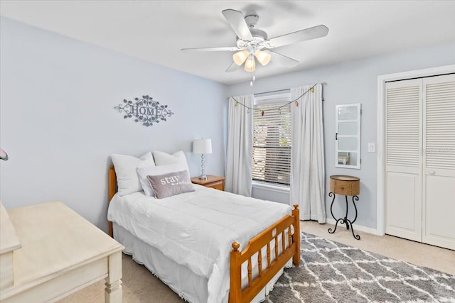 bedroom with carpet flooring, a closet, and ceiling fan