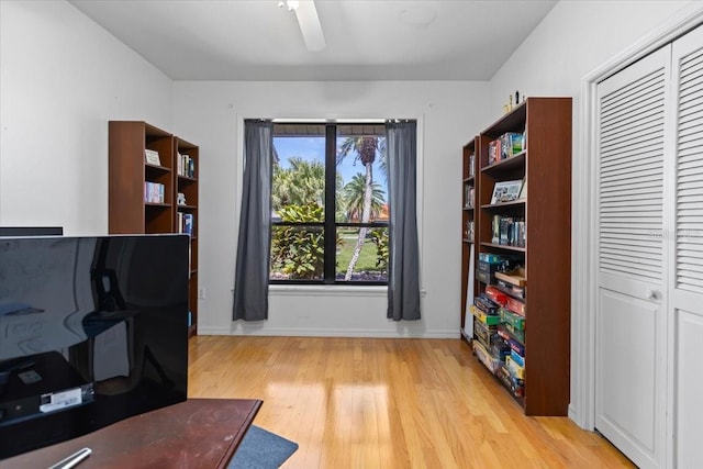 office area with ceiling fan and light hardwood / wood-style flooring