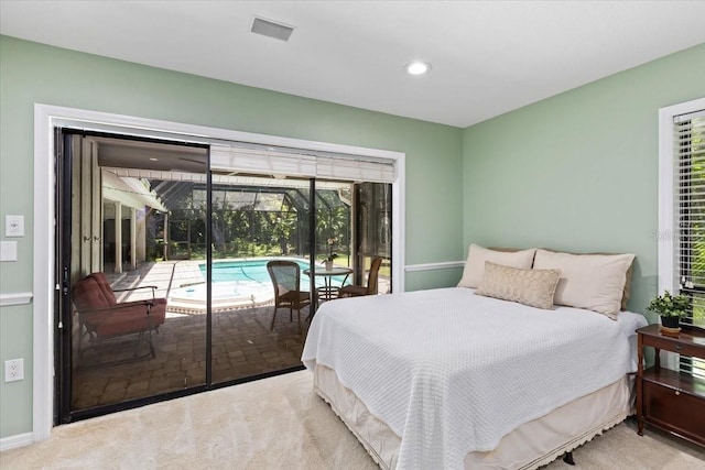 carpeted bedroom featuring access to outside