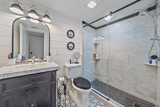 bathroom with wooden walls, vanity, an enclosed shower, and toilet