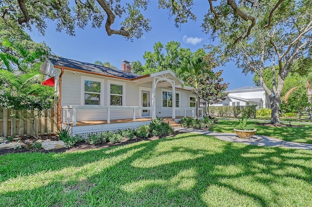 back of house with a lawn