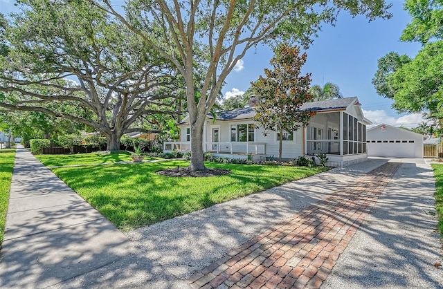 view of front of house with a front yard and a garage