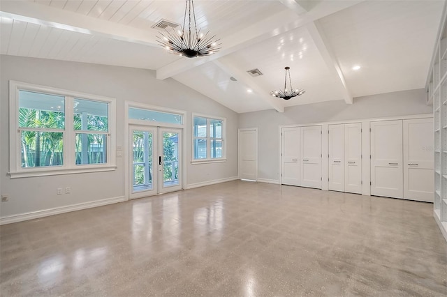 unfurnished living room featuring a chandelier, french doors, a healthy amount of sunlight, and beam ceiling