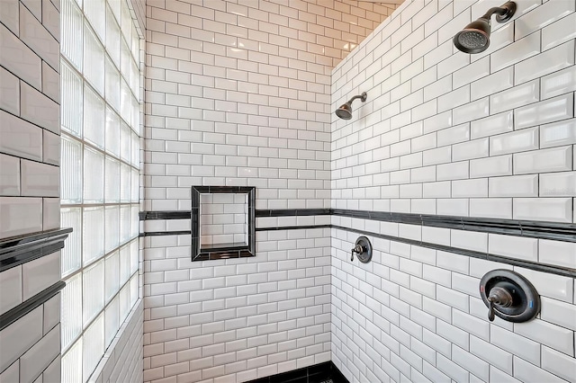 bathroom with tiled shower