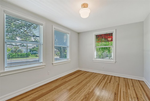 spare room with light hardwood / wood-style floors