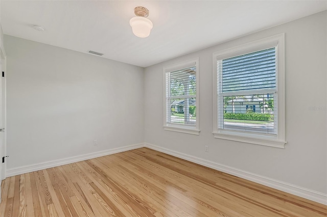 unfurnished room featuring light hardwood / wood-style floors