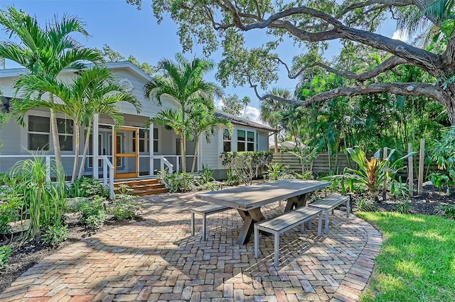 view of patio / terrace with a sunroom