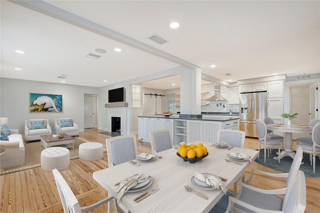 dining space featuring light hardwood / wood-style flooring