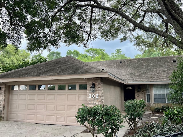 ranch-style home with a garage