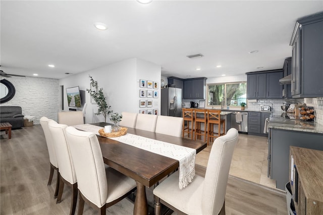 dining area featuring light wood-style flooring, visible vents, ceiling fan, and recessed lighting