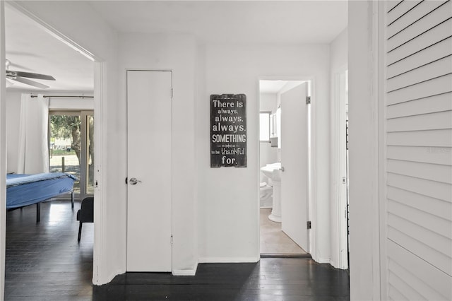 hallway featuring dark hardwood / wood-style floors