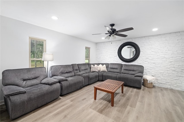 living area with light wood finished floors, ceiling fan, and recessed lighting