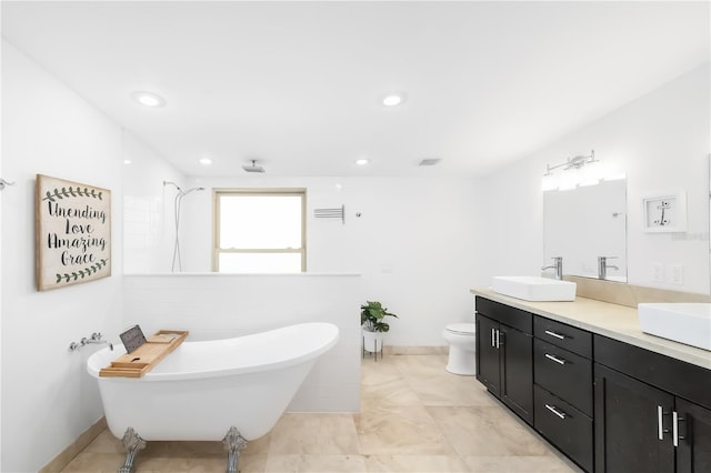 full bath featuring double vanity, a soaking tub, toilet, a sink, and walk in shower