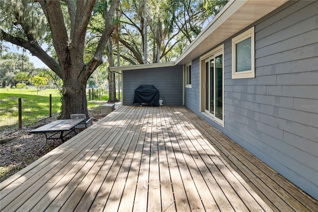 deck featuring a grill