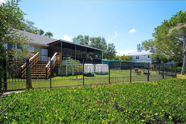 view of yard with a sunroom