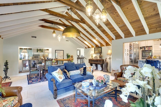 living room featuring beamed ceiling, high vaulted ceiling, and a chandelier