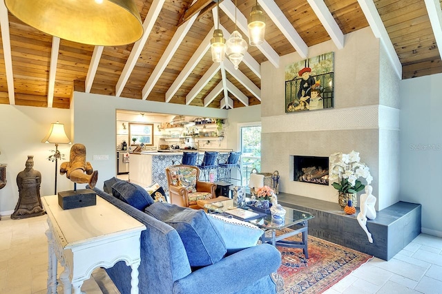 living room featuring beamed ceiling, high vaulted ceiling, indoor bar, light tile patterned floors, and wood ceiling