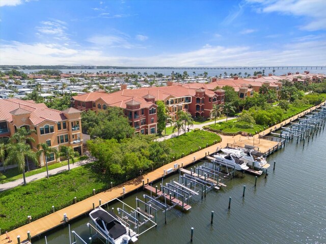 birds eye view of property featuring a water view