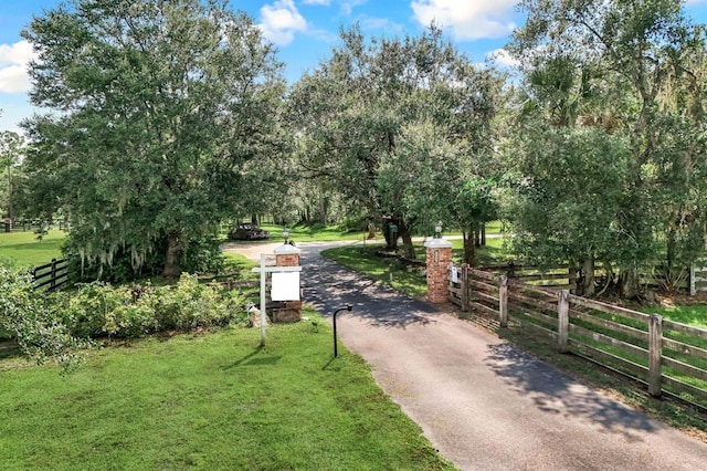 view of home's community with a lawn