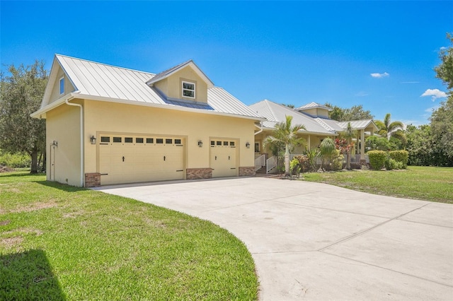 16990 River Boat Bnd, Alva, FL 33920 - view of front of home with stucco siding, metal roof, a standing seam roof, and a front yard