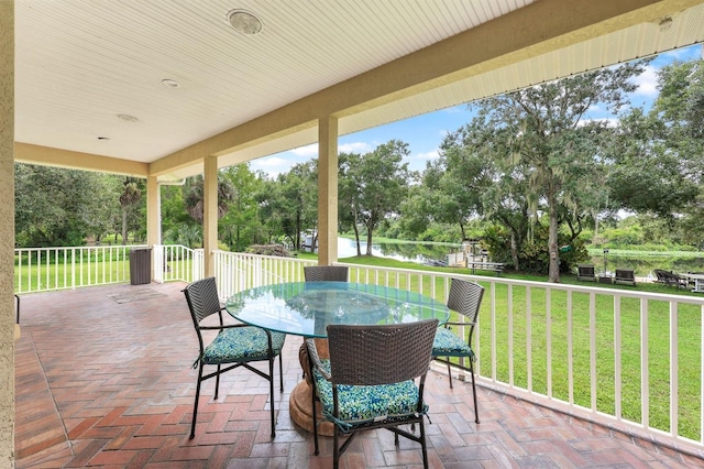 view of patio with a water view