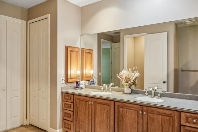 bathroom featuring tile patterned floors and vanity