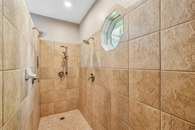 bathroom with a tile shower