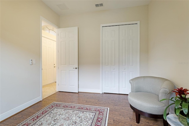 living area with dark hardwood / wood-style floors