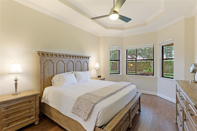 bedroom featuring a raised ceiling, ceiling fan, crown molding, and dark hardwood / wood-style floors