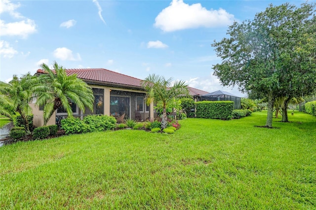 view of yard with a lanai