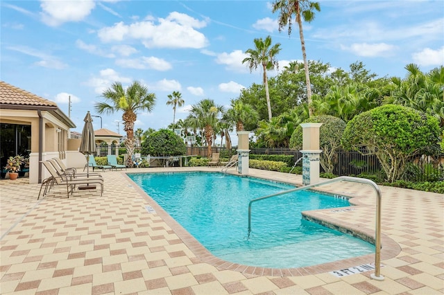 view of swimming pool with a patio area