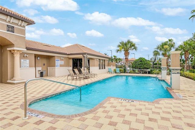 view of swimming pool with a patio area