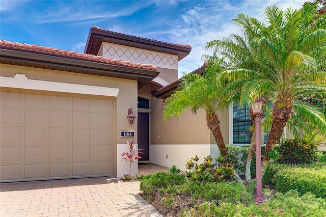 mediterranean / spanish-style home featuring a garage