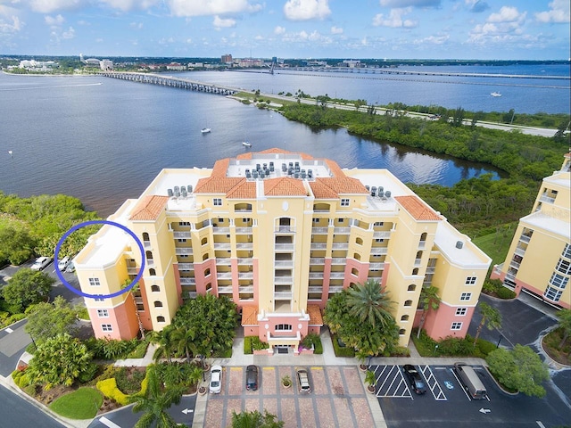 birds eye view of property with a water view