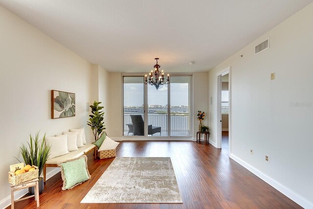 interior space with a chandelier and hardwood / wood-style flooring