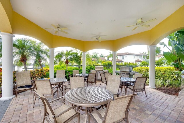 view of patio with ceiling fan and an outdoor kitchen