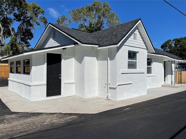 view of side of property with a patio area