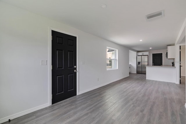 unfurnished living room featuring light hardwood / wood-style flooring