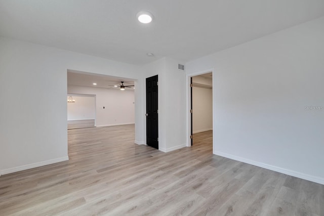 spare room with ceiling fan and light hardwood / wood-style floors