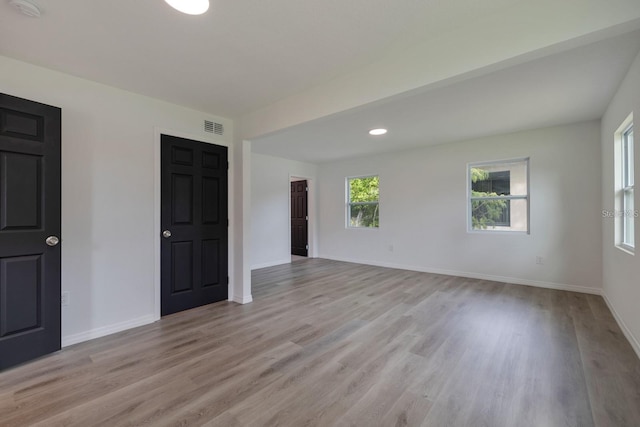 empty room with light wood-type flooring