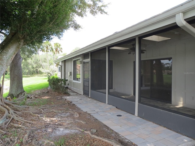 view of patio with a sunroom