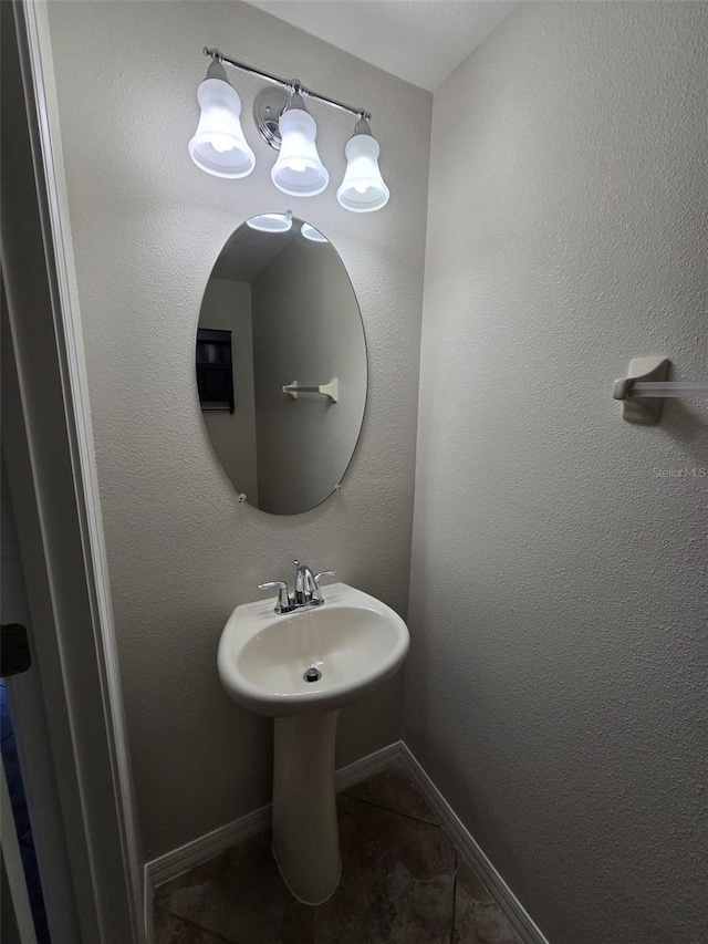 bathroom with tile patterned floors and sink