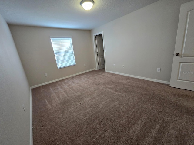 empty room with carpet flooring