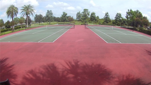 view of tennis court featuring basketball hoop