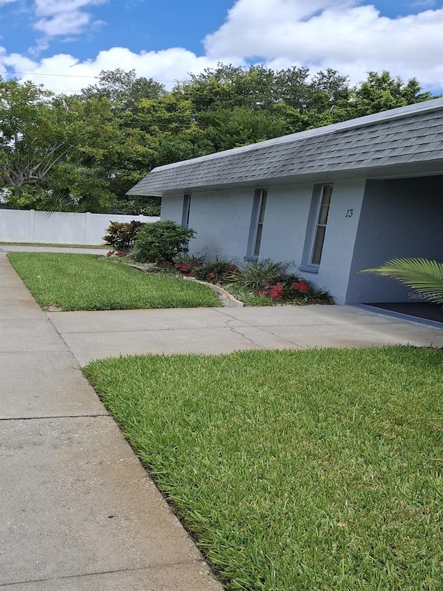 view of home's exterior featuring a yard