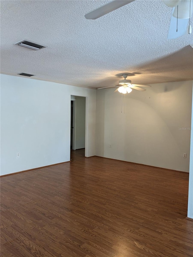 unfurnished room featuring dark hardwood / wood-style flooring, a textured ceiling, and ceiling fan