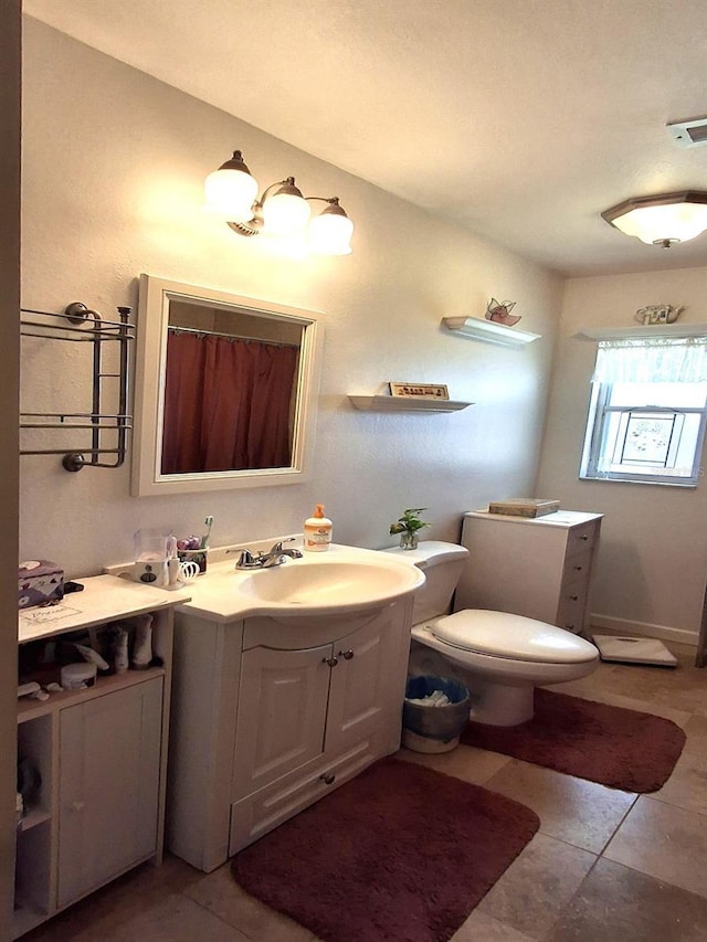 bathroom with tile patterned flooring, vanity, a shower with shower curtain, and toilet