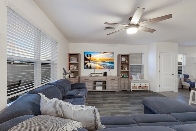 living room with hardwood / wood-style flooring and ceiling fan