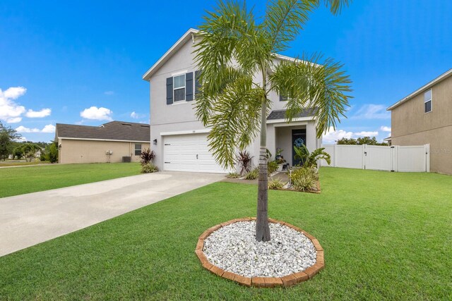 view of front of house with a front lawn and a garage