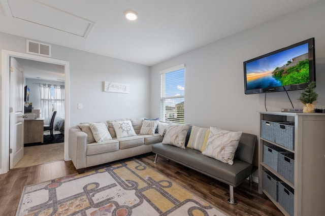 living room with dark hardwood / wood-style flooring